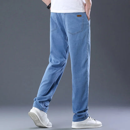 Calça Masculina Casual de Verão – Tecido Leve, Cintura Alta, Jeans de Algodão com Elastano, Lavagem Efeito "Ice Silk", Corte Reto e Solto
