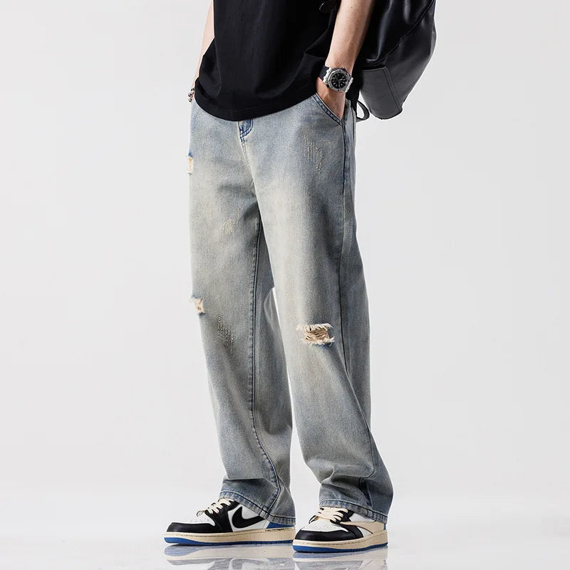 Jeans estilo europeu e americano com rasgos e visual vintage — modelo casual e folgado (baggy) — pronta-entrega.