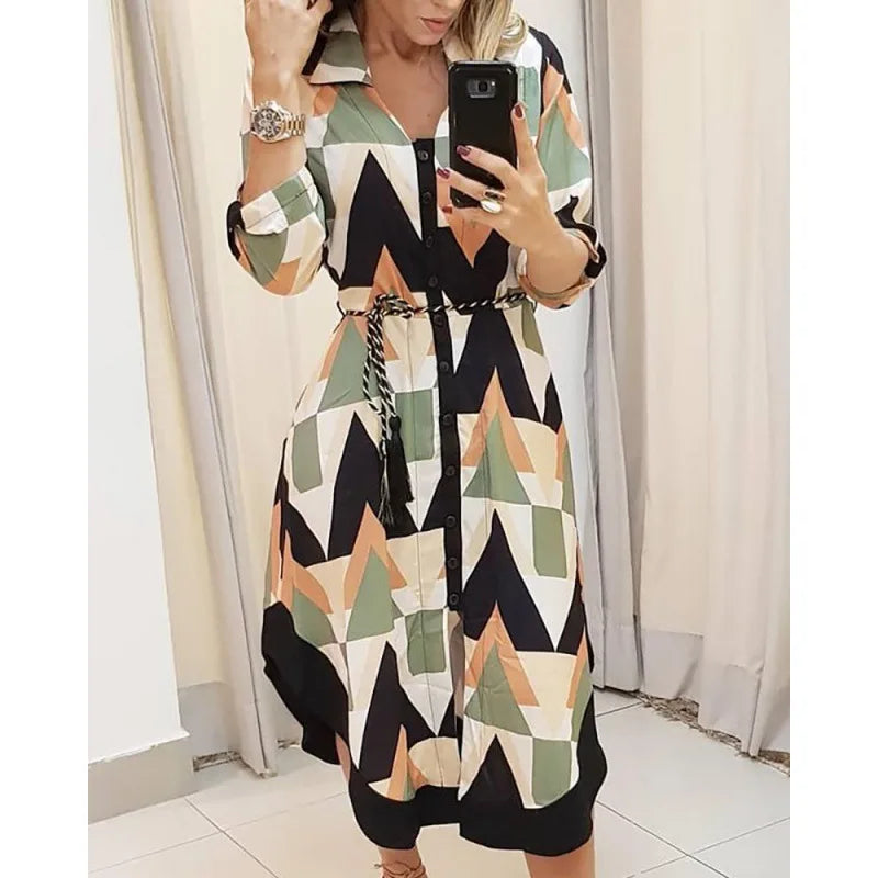 Novo vestido longo feminino de outono com estampa geométrica, decote em V, estilo camisa color block, com laço na lapela e barra assimétrica.