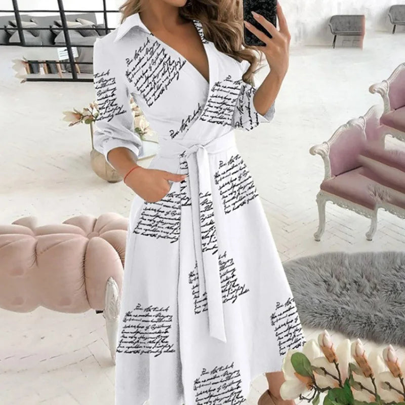 Novo vestido longo feminino de outono com estampa geométrica, decote em V, estilo camisa color block, com laço na lapela e barra assimétrica.