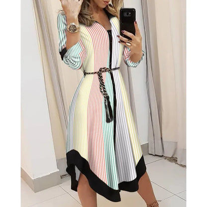 Novo vestido longo feminino de outono com estampa geométrica, decote em V, estilo camisa color block, com laço na lapela e barra assimétrica.