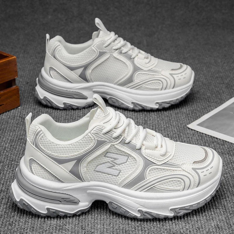 Tênis esportivo casual masculino, ideal para uso confortável durante todo o ano, com cadarço, cano baixo e respirável.