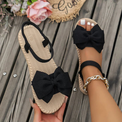 Sandálias femininas antiderrapantes da moda, leves e estilosas para o verão, ideais para praia, uso casual, com laço e design rasteiro.