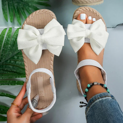 Sandálias femininas antiderrapantes da moda, leves e estilosas para o verão, ideais para praia, uso casual, com laço e design rasteiro.