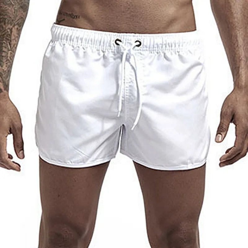 Calções de banho masculinos para o verão, calções de banho de marca, calções de banho sensuais, fatos de banho masculinos de cintura baixa e respiráveis para a praia.