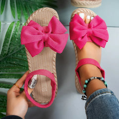 Sandálias femininas antiderrapantes da moda, leves e estilosas para o verão, ideais para praia, uso casual, com laço e design rasteiro.
