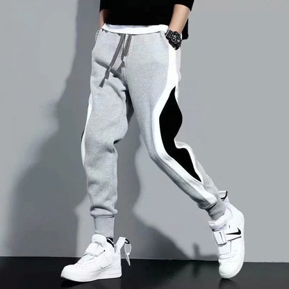 Calças esportivas masculinas para primavera e outono, leggings folgadas com detalhes em patchwork para corrida e treino, calças casuais da moda.