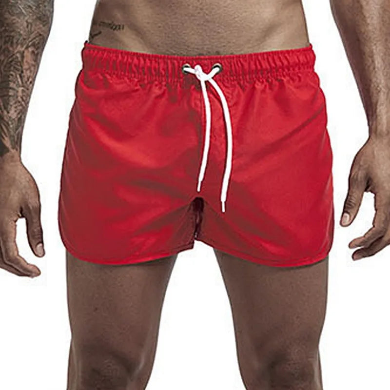 Calções de banho masculinos para o verão, calções de banho de marca, calções de banho sensuais, fatos de banho masculinos de cintura baixa e respiráveis para a praia.